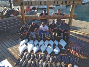 Group of men displaying their bounty of caught sea life