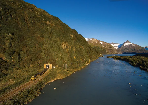 The Glacier Discovery has just exited Portage Tunnel on a glorious night for photography in Alaska.