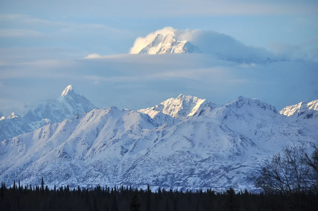 Mount Denali summit emerging out of cloud cover