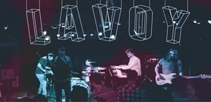 Lavoy performing at a show