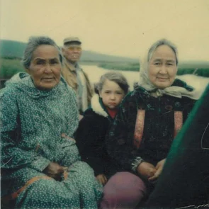Buffy boating in Nome with her grandparents, Grandpa Ben Herman operating the boat in the back, Grandma Esther Herman on the right and Grandma’s sister Maude, on the left