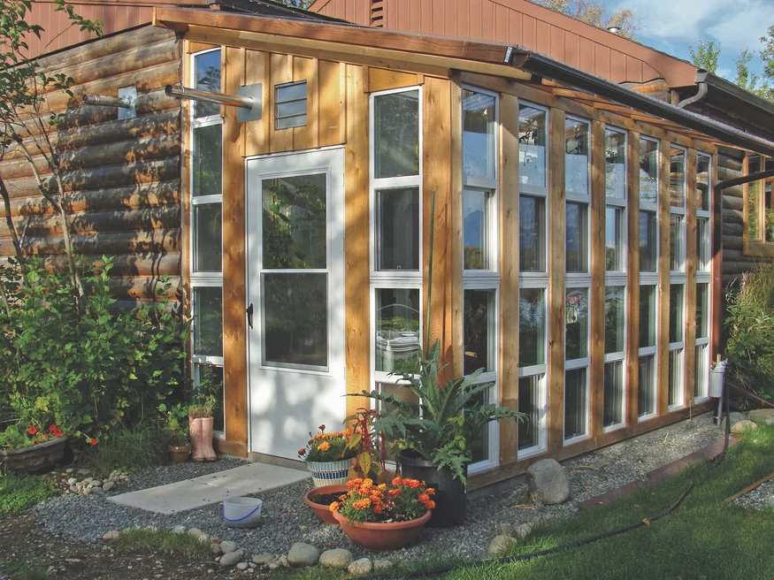 Outside view of greenhouse on sunny day.